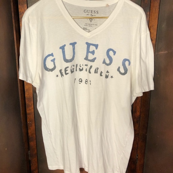 blue and white guess shirt